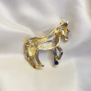 Detailed back view of vintage gold-tone zebra brooch showing the pin closure mechanism.