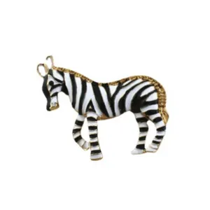 Detailed view of hand-painted enamel zebra brooch with gold-toned metal accents