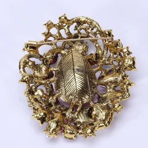 Detailed back view of vintage Bohemian luxury crystal brooch with gold-tone finish