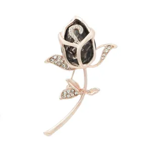 Detailed view of an elegant rose brooch with smoky gray crystal and rhinestones