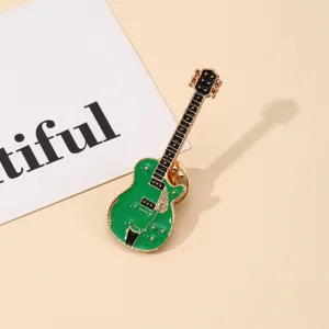 Stylish green electric guitar enamel brooch pin with gold-tone finish and music theme
