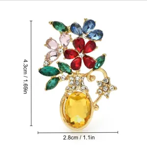 Close-up of elegant flower vase brooch with precise height and width measurements