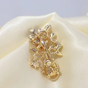 Detail view of an elegant gold vase-shaped brooch showing the back pin mechanism.
