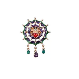 Gothic style spider web brooch with red heart gemstone and colorful enamel drops
