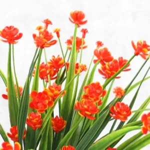 Artificial small peony flowers with vibrant green spring grass for home decoration