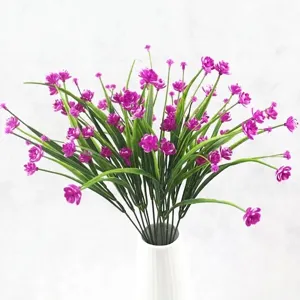 Beautiful purple artificial spring grass peony flowers arranged in a minimalist white ceramic vase