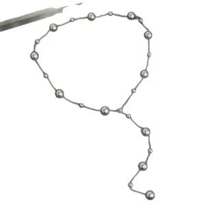 Elegant Y-shaped necklace with grey pearls in a starry sky design for women.