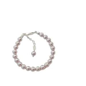 Elegant rose pink pearl bracelet with silver lobster clasp and adjustable extension chain.