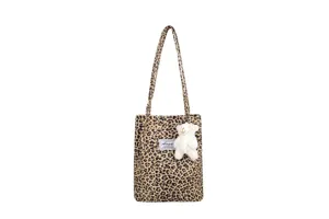 Leopard print canvas tote bag featuring a cute white bear plush charm and August label
