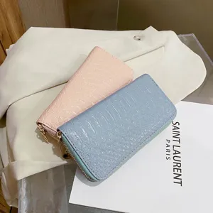Elegant crocodile-textured zip-around long wallets for women in pink and blue