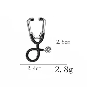 Silver and black enamel stethoscope brooch pin with dimensions 2.5cm x 2.4cm and weight 2.8g