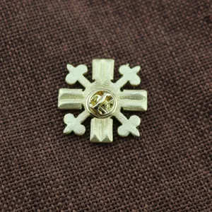 Detailed back view of a matte gold baroque style brooch with butterfly clutch.