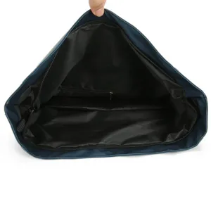 Interior detail showing the black lining and zipper pocket of navy blue backpack