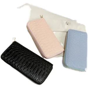 Stylish women's long wallets with crocodile texture in black, pink, and blue.