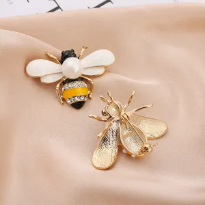 Detailed front and back view of elegant bee brooch with pearl and rhinestone accents