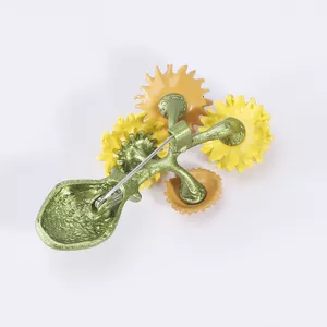 Detailed back view of enamel sunflower brooch showing the secure metal pin closure.