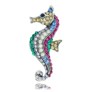Close-up detail showing colorful rhinestones on a vintage alloy seahorse brooch pin