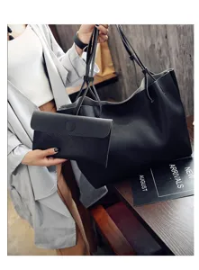Schwarze Henkeltasche aus genarbtem Leder mit passender Tasche, stylische Alltagstasche.