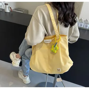 Bolso tote de lona amarilla con correa para el hombro, bolso informal para estudiantes.