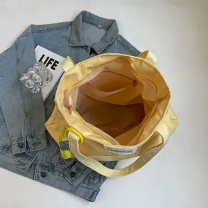 Bolso tote de lona amarilla casual de gran capacidad con bolsillo interior para diario.