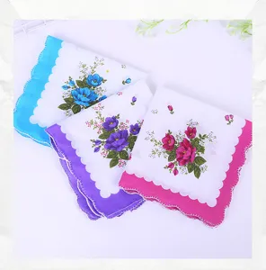 Detailed view of three soft floral cotton handkerchiefs featuring vibrant scalloped edges