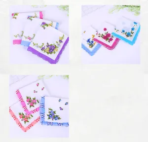 Detailed view of colorful vintage floral prints and scalloped lace edges on cotton handkerchiefs