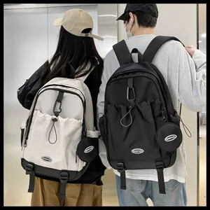 Vue arrière de sacs à dos de sport à cordon noir et blanc de grande capacité pour étudiants