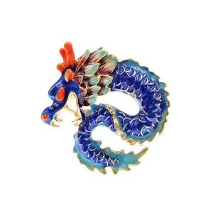 Macro close-up detail of a blue enamel Chinese zodiac dragon brooch with gold accents