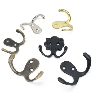 Detailed macro view of antique zinc alloy double coat hooks in various metallic finishes