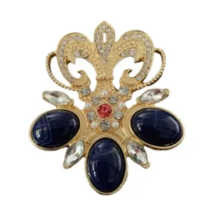 Baroque style vintage brooch with dark blue stones and clear rhinestones detail
