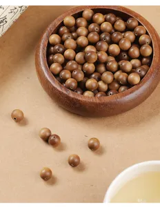 Macro view of high-quality natural sandalwood loose beads for DIY jewelry making