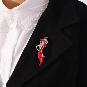 Detail of a stylish modern lady enamel brooch with a red dress on a black blazer.