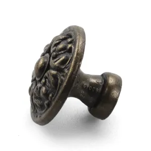 Detailed view of vintage bronze zinc alloy cabinet knob featuring ornate floral engravings