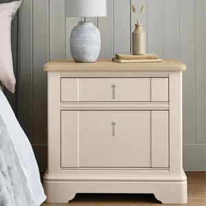 Modern zinc alloy pendant drawer handles installed on a cream bedside nightstand