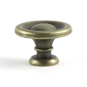 Detail showing texture and finish of the vintage bronze furniture pull handle knob