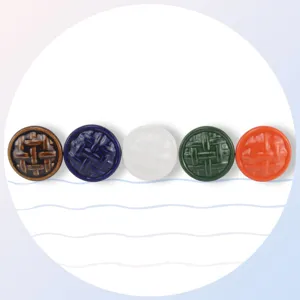 Detailed view of colorful woven ceramic cabinet knobs, vintage single-hole furniture drawer handles.