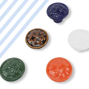 Set of five colorful ceramic cabinet knobs with textured woven design for furniture drawers.