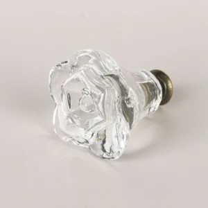 Elegant clear acrylic rose-shaped cabinet knob with antique bronze metal base.