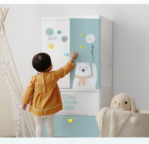 Adorable cloud and bow ceramic knobs shown on a child's bedroom storage cabinet.