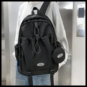Sac à dos noir à cordon pour l'école avec petite pochette ronde amovible et mousqueton