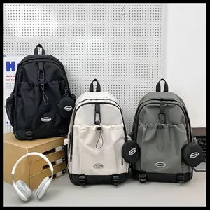 Sacs à dos à cordon grande capacité en noir, blanc et gris avec de petites pochettes.