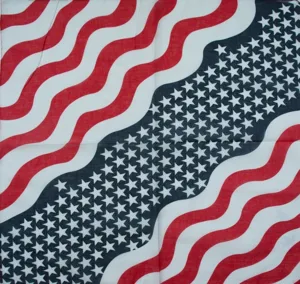 Close-up detail of the patriotic American flag pattern on a soft pure cotton square bandana.