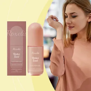 Roxelis Amber αρωματικό σπρέι μαλλιών σε ροζ μπουκάλι 50ml, λεπτομερής απεικόνιση.