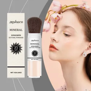 Κοντινό πλάνο της πούδρας Zephoco SPF 35 με ενσωματωμένο πινέλο εφαρμογής