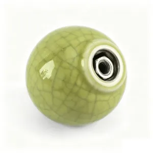 Detail view showing the metal threaded insert of a crackle glaze ceramic round knob