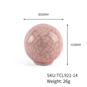 Detailed view of pink cracked glaze ceramic round knob with 28mm diameter and height