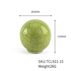 Detailed view of a green cracked glaze ceramic knob with a diameter and height of 28mm.
