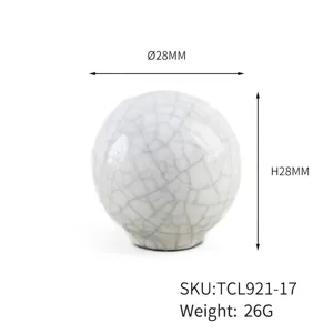 Close-up view of a cracked ceramic ball cabinet knob with 28mm diameter and height labels