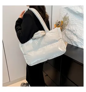 Stylish large white puffer tote bag made of padded space cotton shown on model