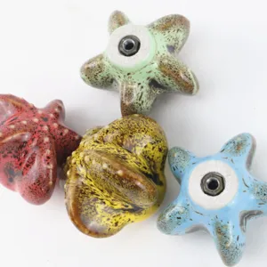 Close-up of colorful leopard print starfish ceramic cabinet knobs for drawers and wardrobes